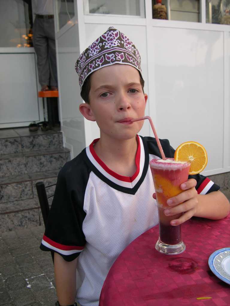 Muscat 03 Mutrah 08 Drinking Cocktail Juice Because the Middle East is largely alcohol-free, other beverages are highly evolved, especially the fruit cocktail. We had a cocktail containing five different fruit juices at Fastfood �n� Juice Centre just to the left of the entrance to the Mutrah Souq.